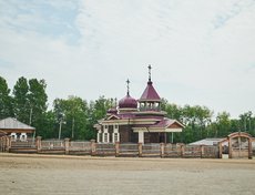 Слева от входа расположена Троицкая церковь, вывезенная из деревни Дядиной Жигаловского района Иркутской области. Она была построена там в 1915 году бригадой латышей.